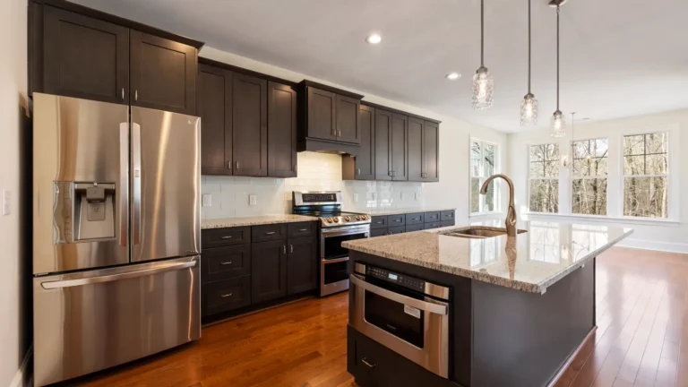 Waterproof flooring options: what homeowners should compare Modern kitchen with a visible brown hard-surface floor